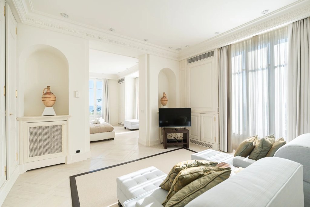 The suite and its alcove sitting room, the sea through the far window.